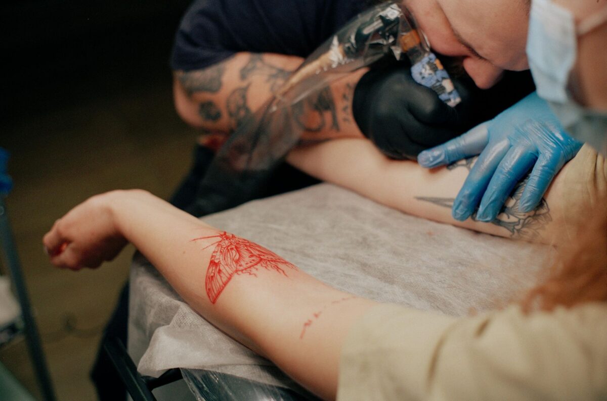 A tattoo apprentice learning in a studio